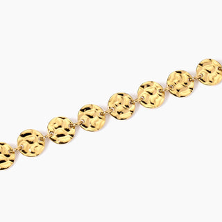 831007

Bracciale dorato con tondi effetto martellato
Style 03