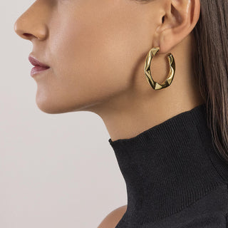 861022

Orecchini poligonali dorati
Style 09