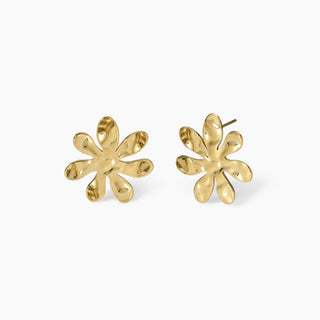 861042

Orecchini dorati con fiore effetto martellato
Style 16
